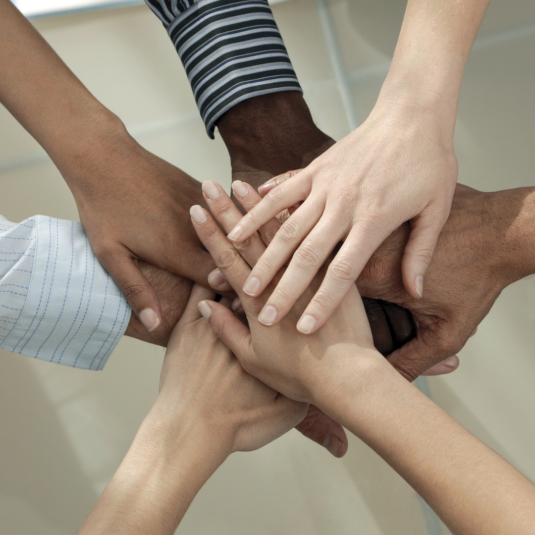 hands of different races all together 