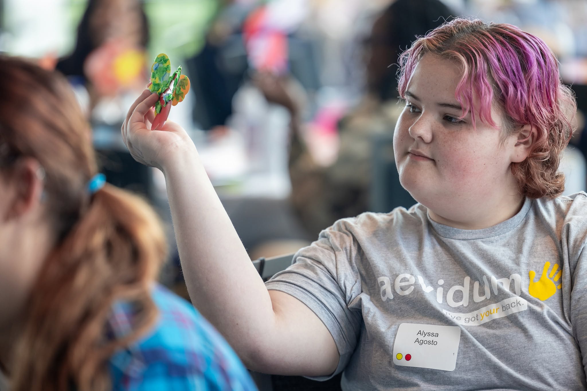 student wearing an aevidum shirt 
