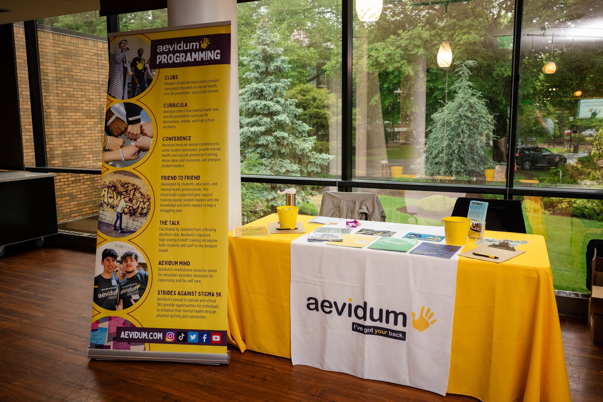a table with aevidum merch